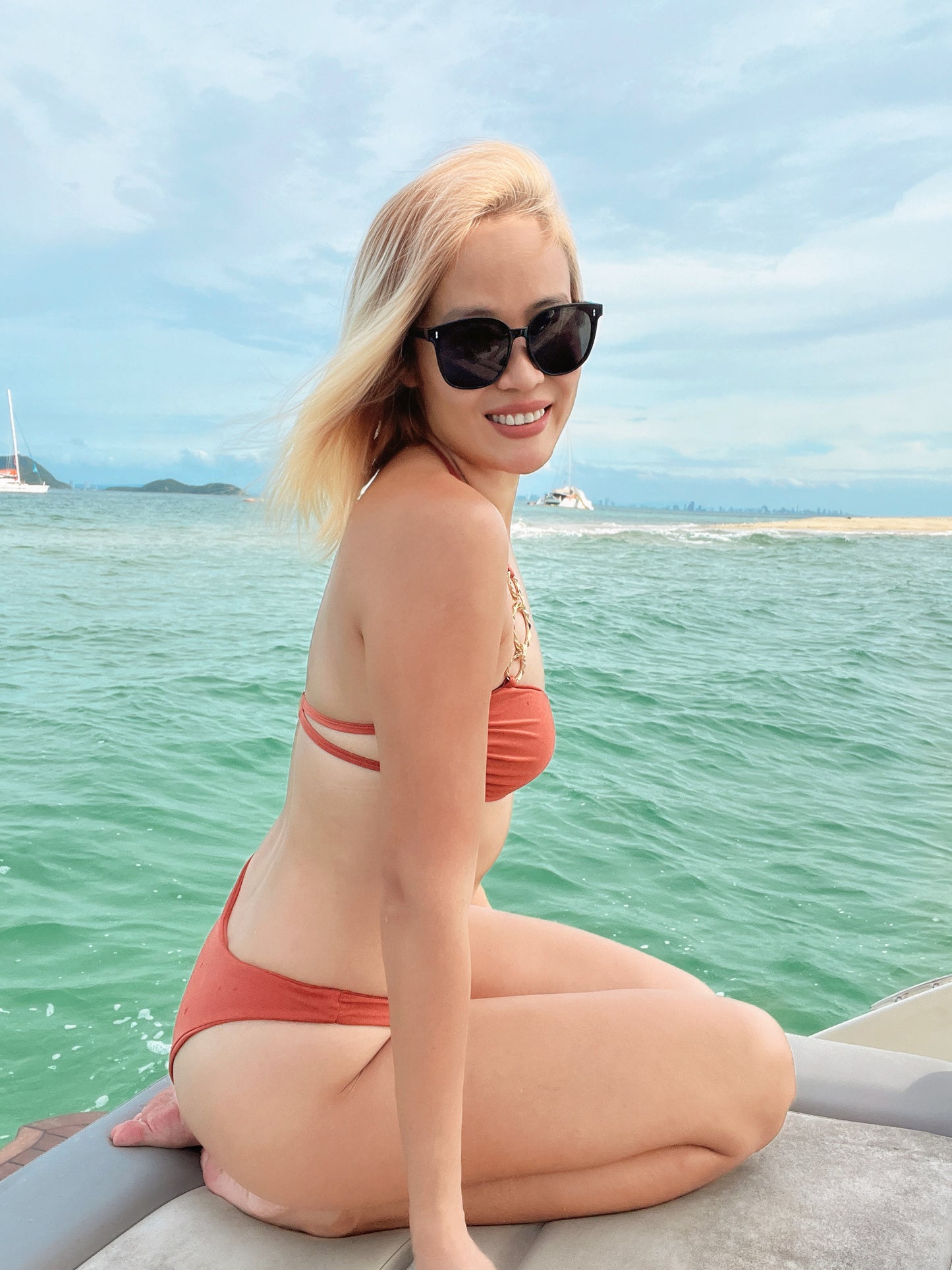 BHUSANAKAN SWIMWEAR บิกินี่รุ่น "Cinnamon Bittern" บิกินี่สีส้มอิฐ ผ้าว่ายน้ำ shiny แต่งห่วงทอง